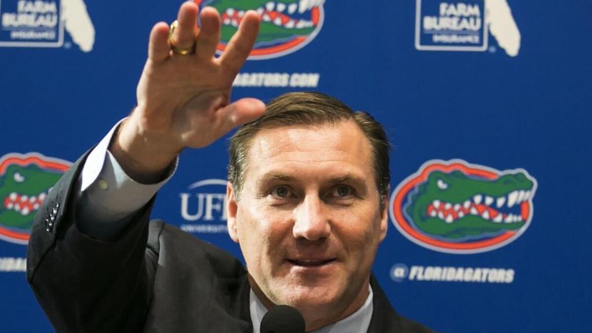 In this Nov. 27, 2017, file photo, Dan Mullen, the new head football coach at the University of Florida, is introduced during a news conference in Gainesville, Fla. Mullen has told everyone who would listen his plan to return the Gators to national prominence. Now, he gets to show it. Florida opens spring practice Friday with hopes of finally fixing an offense that has been dormant for nearly a decade.