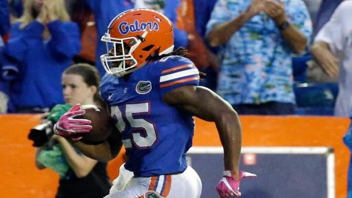Florida running back Jordan Scarlett, left, runs for a 33-yard touchdown against Missouri on Oct. 15, 2016.