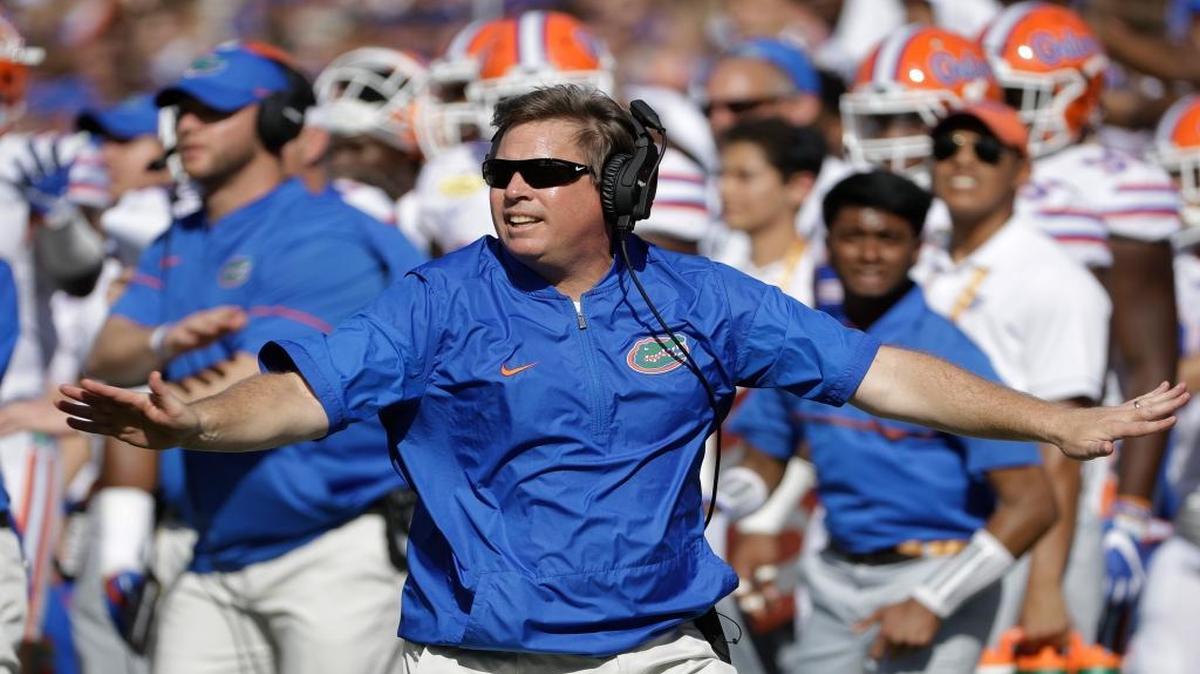 FILE - In this Monday, Jan. 2, 2017 file photo, Florida head coach Jim McElwain reacts to a dropped pass by Iowa during the first half of the Outback Bowl NCAA college football game in Tampa, Fla.