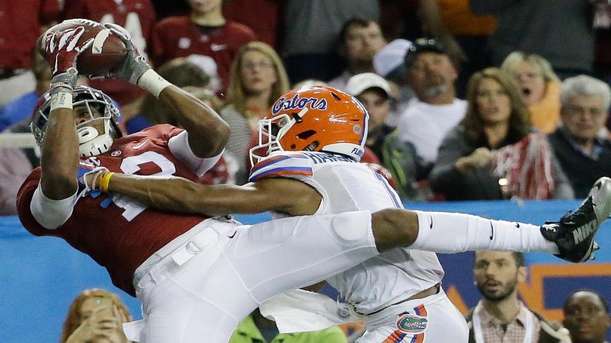 Alabama wide receiver ArDarius Stewart (13) makes a touchdown catch against Florida defensive back Vernon Hargreaves III (1) during the second half of the Southeastern Conference championship NCAA college football game, Saturday, Dec. 5, 2015, in Atlanta.