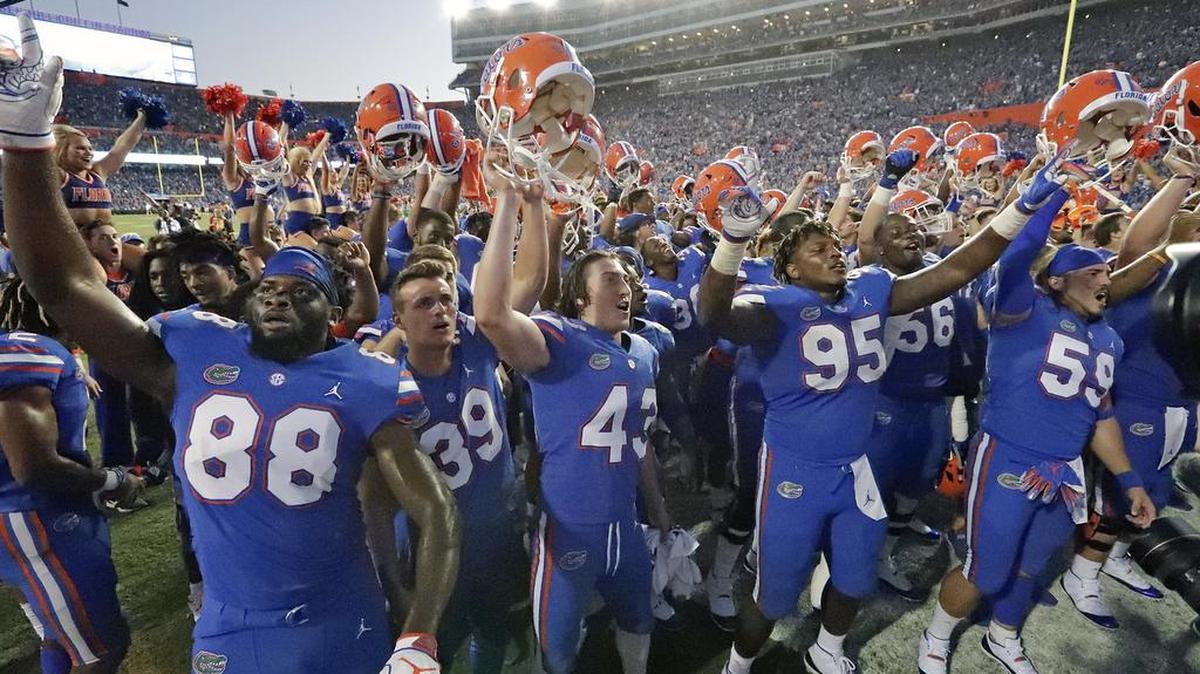 Florida players celebrate in front of fans after defeating LSU 27-19 in an NCAA college football game Saturday, Oct. 6, 2018, in Gainesville, Fla.