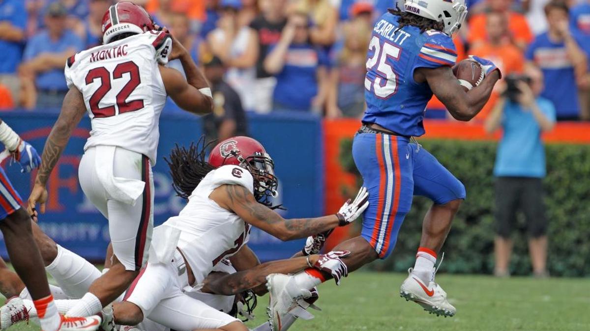 Running back Jordan Scarlett and No. 17 Florida will meet No. 11 Michigan on Saturday in Arlington, Texas, in a nationally televised game.