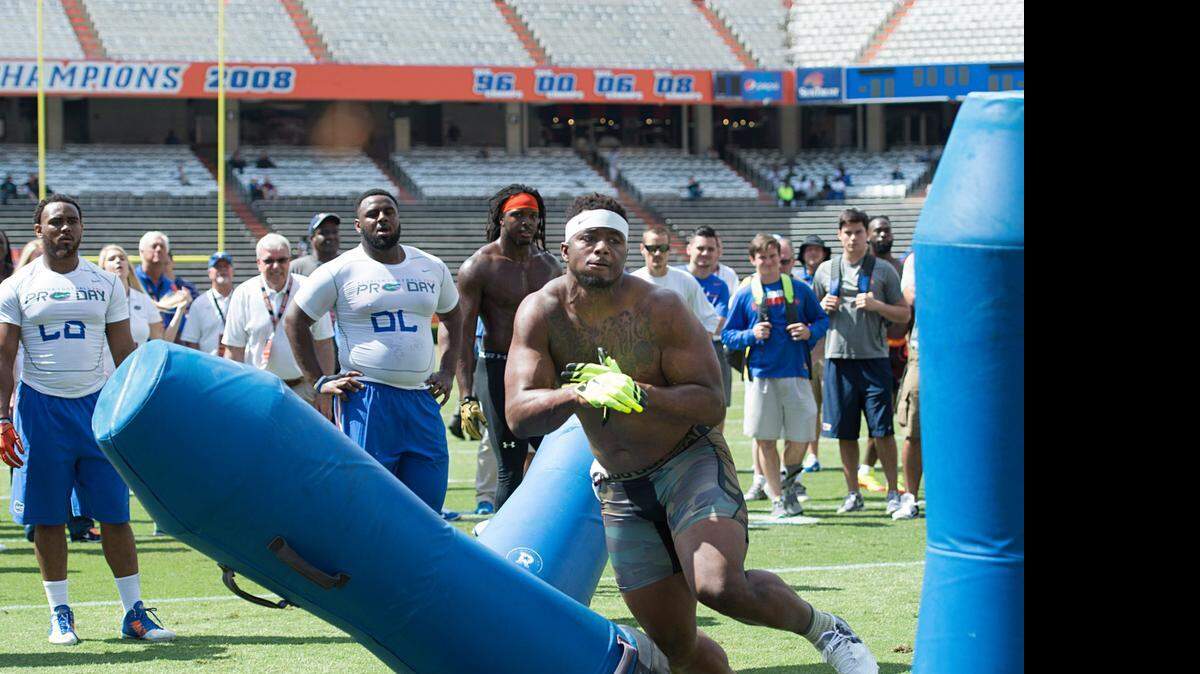 
Dante Fowler Jr. runs through drills during Pro Scout Day at the University of Florida NFL Combine in Gainesville on April 7.
