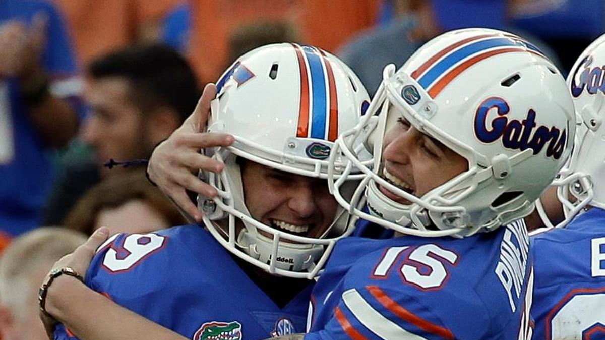 Florida place kicker Eddy Pineiro (15) celebrates a 50-yard field goal against UAB with teammate Johnny Townsend (19) during the first half of an NCAA college football game, Saturday, Nov. 18, 2017, in Gainesville, Fla.