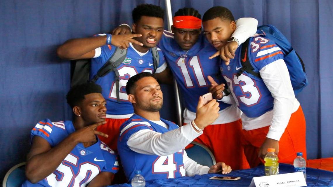 Linebackers Jeremiah Moon (50), Cristian Garcia (43), Kylan Johnson (28) Vosean Joseph (11) and David Reese (33) take a selfie during media day at Ben Hill Griffin Stadium in Gainesville, Fla. Wed., Aug. 2, 2017.