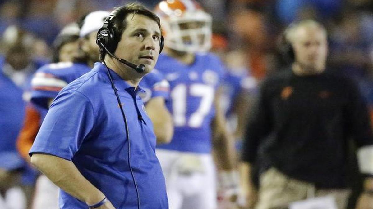 
Florida head coach Will Muschamp looks up at the clock during the second half of an NCAA college football game against Missouri in Gainesville, Fla., Saturday, Oct. 18, 2014. Missouri won 42-13.
