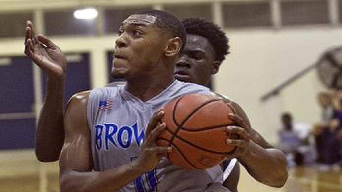 
Broward College guard DeAndre Turner drives to the basket against Chipola College on Monday, Nov. 24, 2014.
