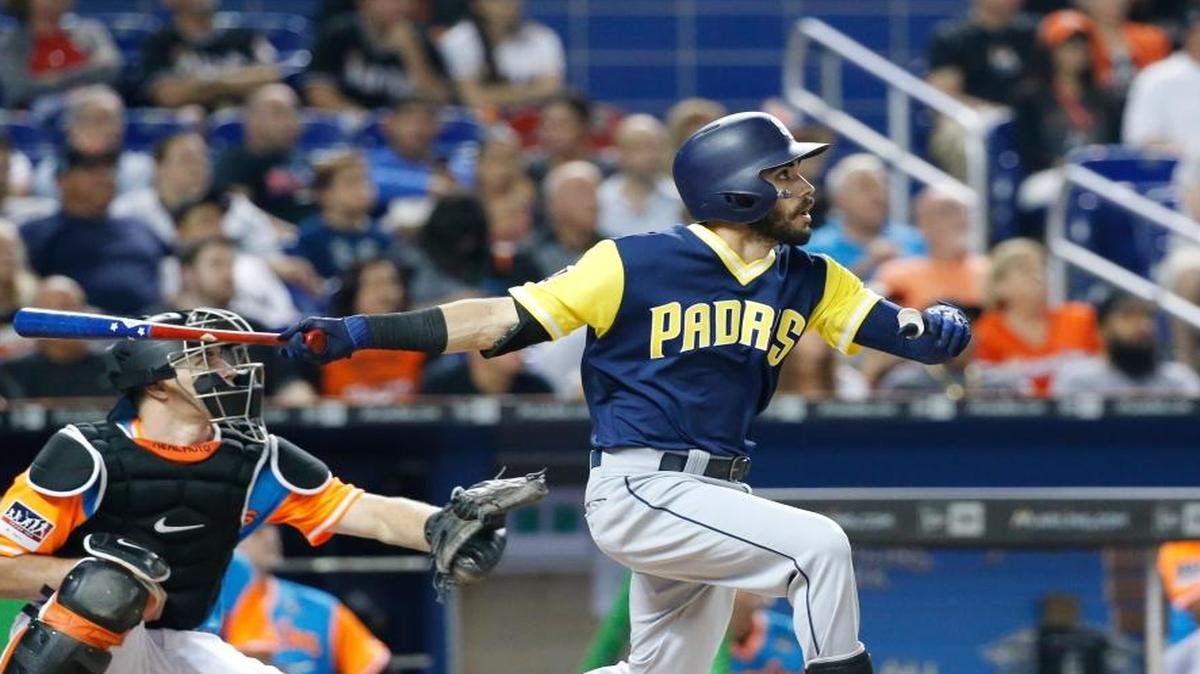 San Diego Padres' Carlos Asuaje bats during the first inning of a baseball game against the Miami Marlins, Friday, Aug. 25, 2017, in Miami.