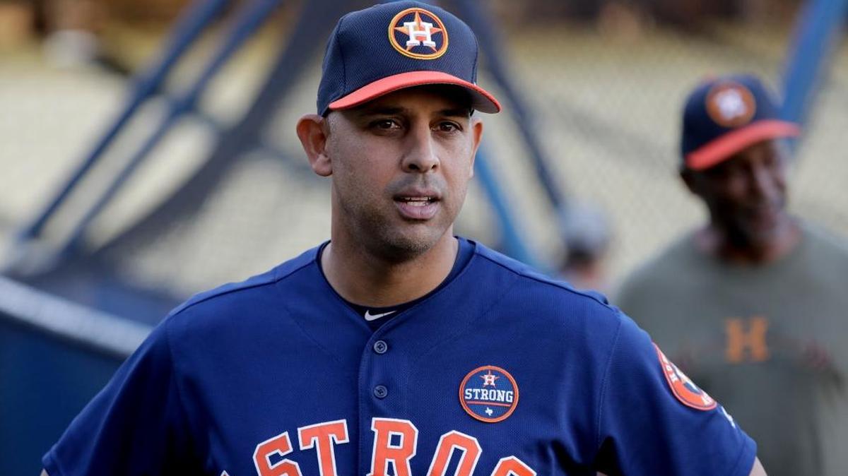 Houston Astros bench coach Alex Cora watches batting practice during media day for baseball's World Series against the Los Angeles Dodgers Monday, Oct. 23, 2017, in Los Angeles.
