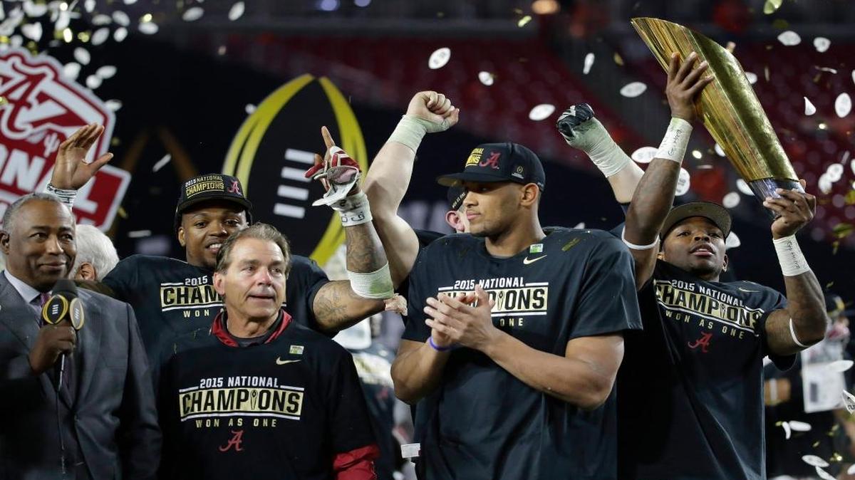 Alabama head coach Nick Saban, second from left, and players celebrate after the NCAA college football playoff championship game against Clemson Monday, Jan. 11, 2016, in Glendale, Ariz. Alabama won 45-40.