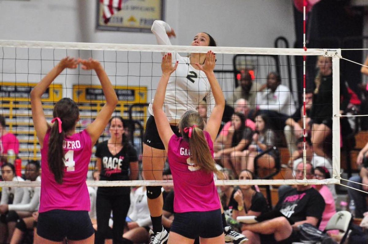 Sylvia Hernandez (No. 2) soars above the defense back in high school at Westminster Christian when she was a hitter.
