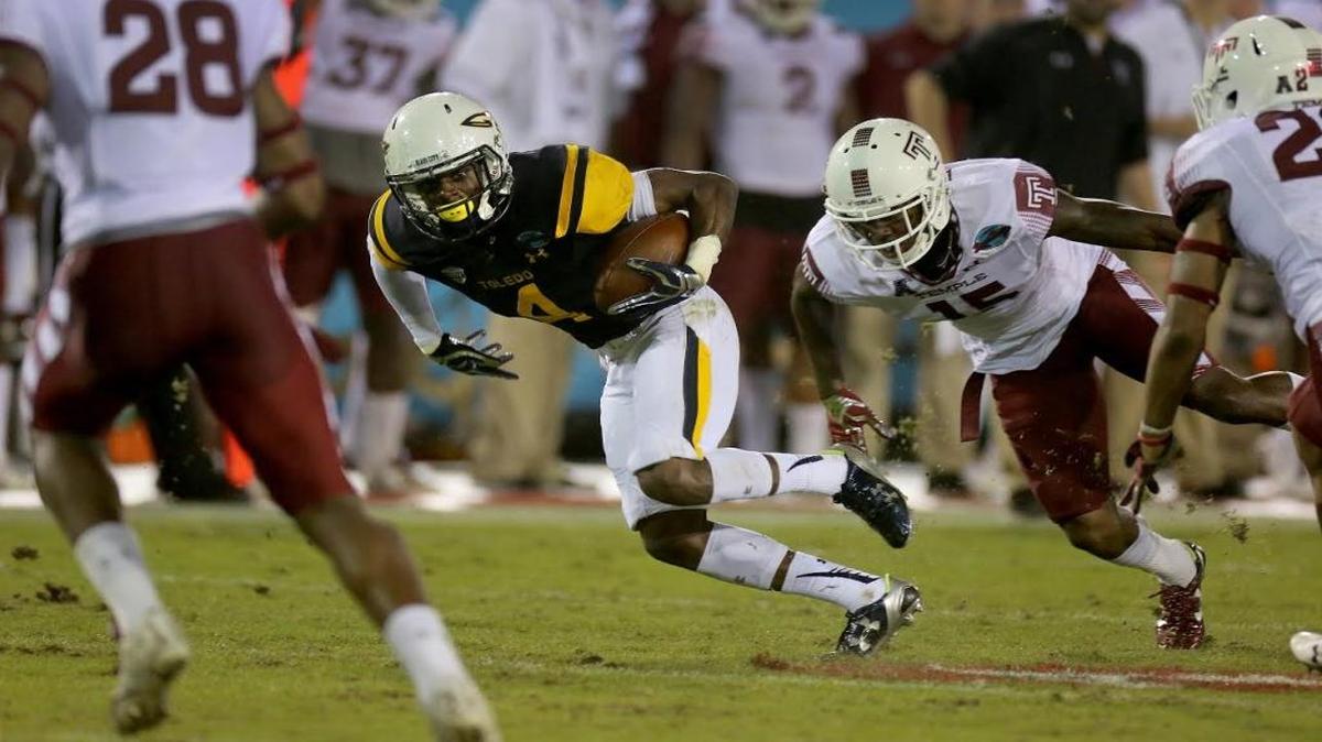 Toledo’s Corey Jones breaks tackles as he heads to the end zone for a touchdown in the second quarter of the Boca Raton Bowl at Florida Atlantic University on Tuesday.
