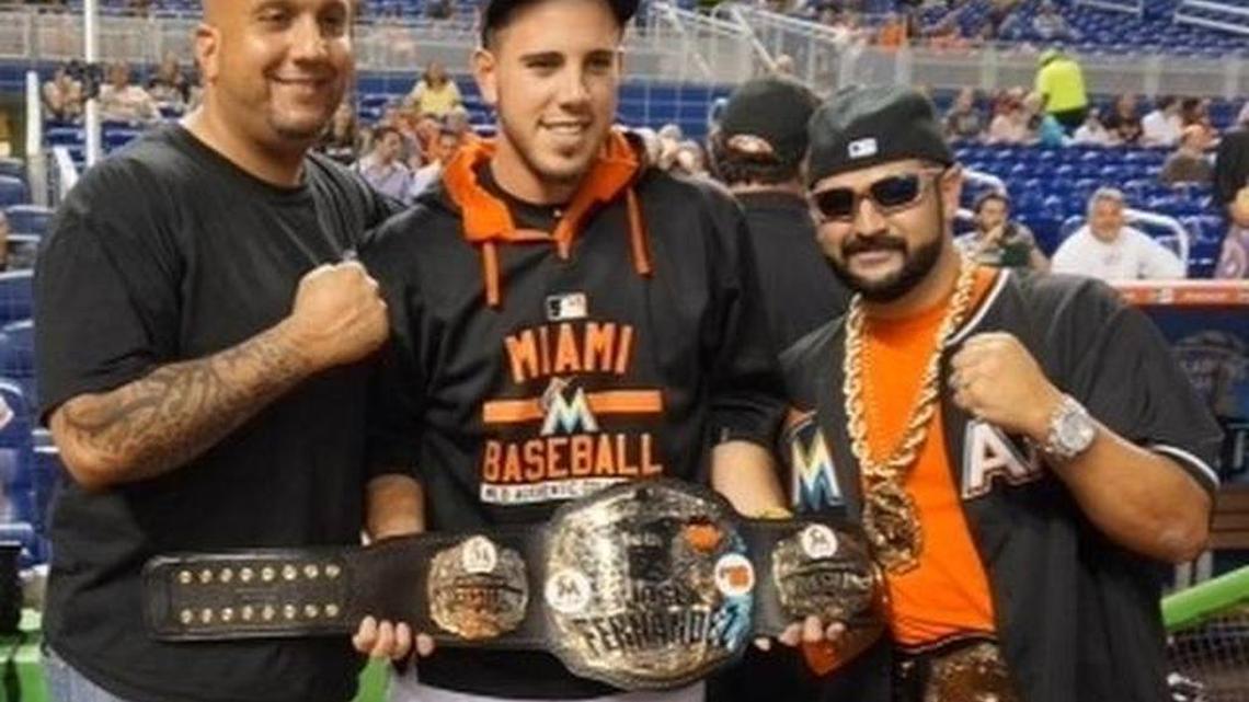 
Miami Marlins pitcher Jose Fernandez was presented with a custom-made, wrestling style championship belt on his birthday by Legends of Wrestling organizer Louis Uncle Louie Gregory (right) and Rey Rey (left) of Rey Rey Championship Belts. The Legends of Wrestling event -- on Friday, July 31 at Marlins Park -- was presented by Uncle Louie and the Marlins and benefited Up2Us Sports.

