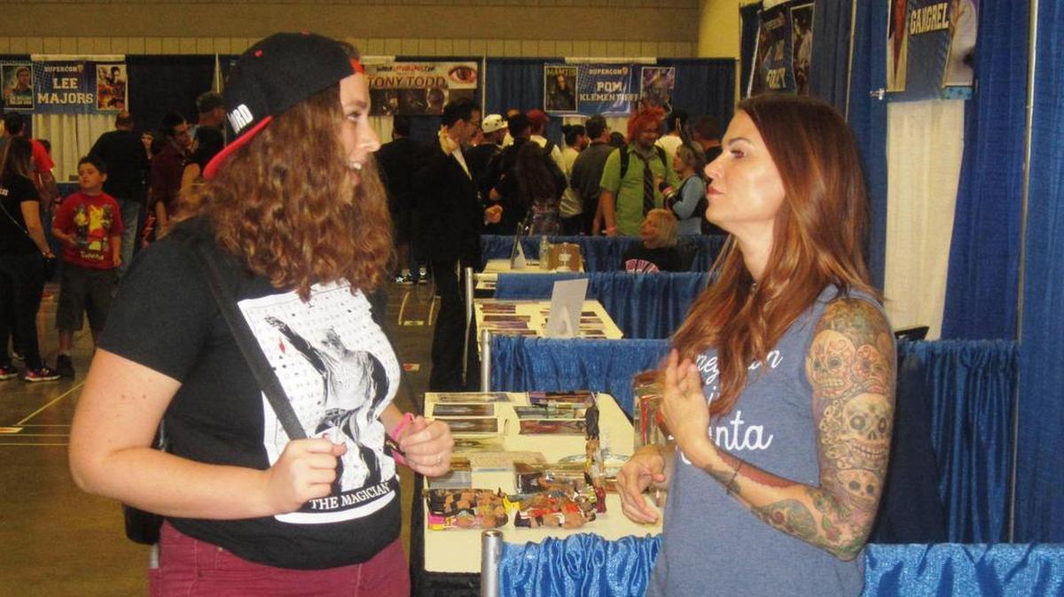 WWE Hall of Famer Lita with a fan during Florida Supercon, one of the state’s biggest comic-cons, at the Broward County Convention Center in Fort Lauderdale. Lita appeared July 28-30, signing autographs, posing for photos, talking to fans and conducting a Q&A.