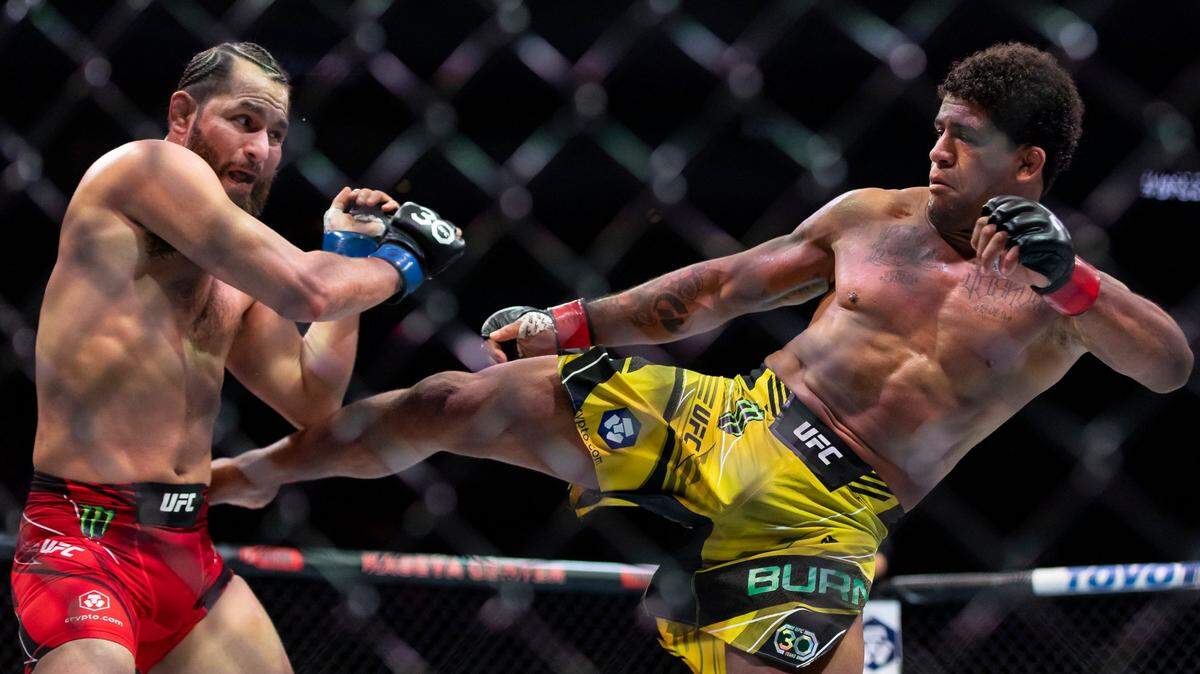 Jorge Masvidal, left, and Gilbert Burns fight in their welterweight title match during the UFC 287 event at the Kaseya Center on Saturday, April 8, 2023, in downtown Miami, Fla.