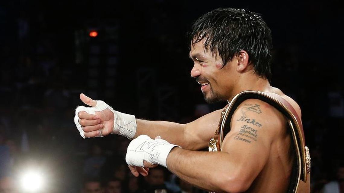 Manny Pacquiao, of the Philippines, celebrates after defeating Timothy Bradley in the WBO welterweight title boxing bout Saturday, April 9, 2016, in Las Vegas.