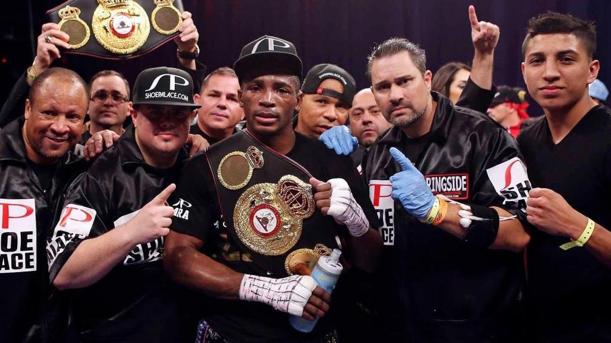 Erislandy Lara poses with his handlers after a super-welterweight victory against Ishe Smith on Dec. 12, 2014 at the Alamodome in San Antonio, Texas.