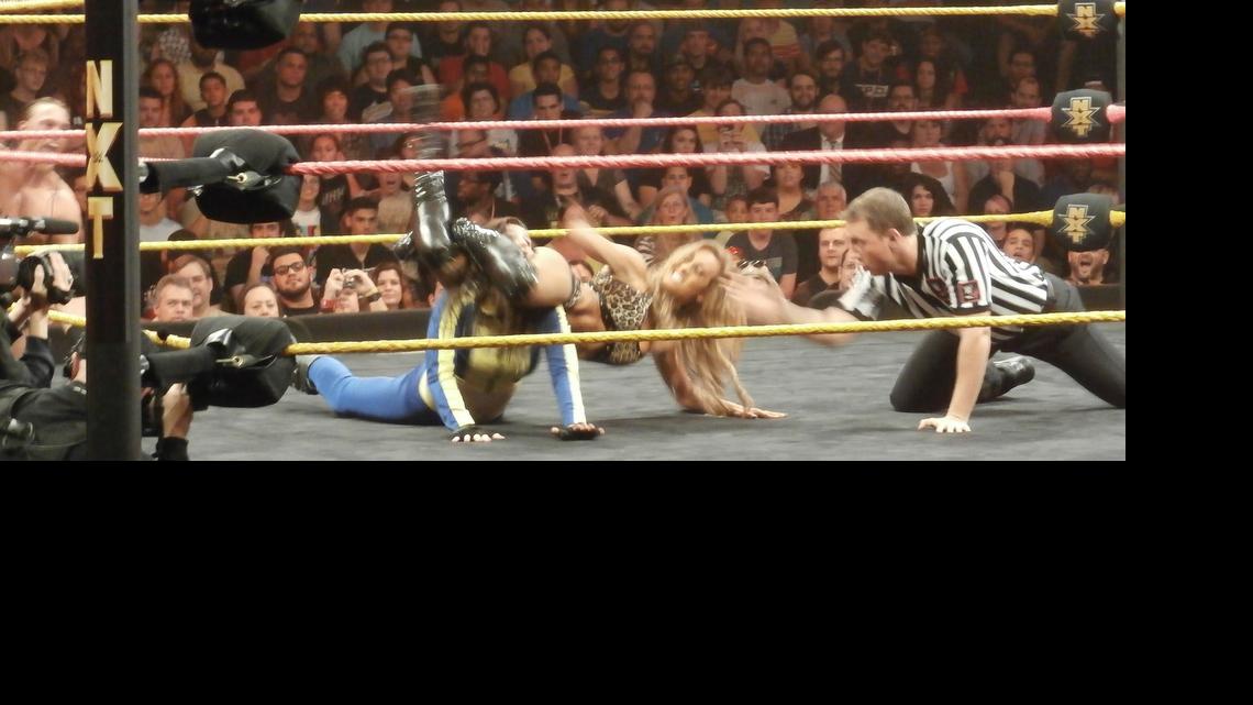 
Carmella head scissors Blue Pants (aka Florida indie talent Leva Bates) during a WWE NXT show at Full Sail Live at Full Sail University in Winter Park, near Orlando. Your referee is Shawn Bennett. NXT will be at the Havert L. Fenn Center on June 5 in Fort Pierce.
