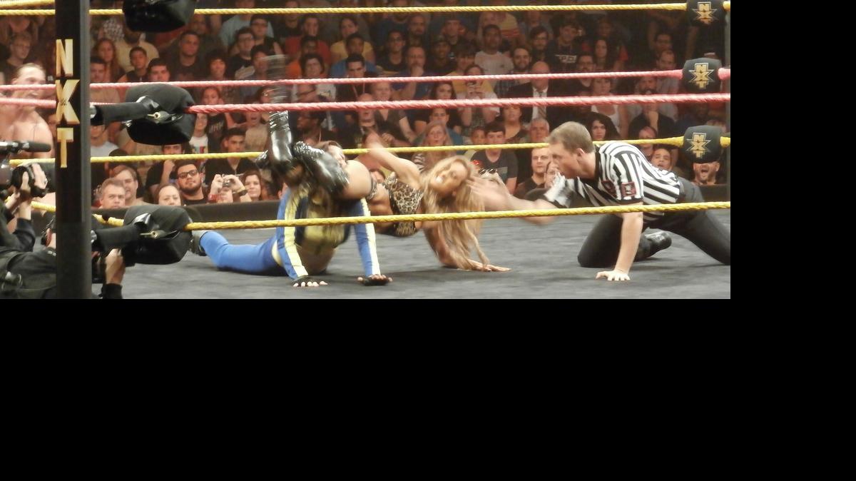 
Carmella head scissors Blue Pants (aka Florida indie talent Leva Bates) during a WWE NXT show at Full Sail Live at Full Sail University in Winter Park, near Orlando. Your referee is Shawn Bennett. NXT will be at the Havert L. Fenn Center on June 5 in Fort Pierce.
