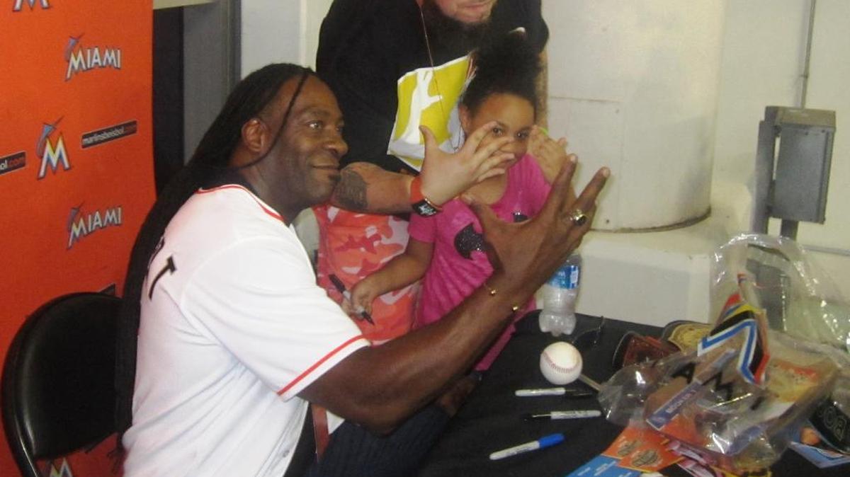WWE Hall of Famer Booker T with fan Larry Conatser and his daughter, CC, during a meet-n-greet at the Legends of Wrestling Night on Saturday, Aug. 27 at Marlins Park.