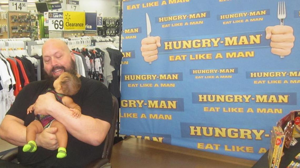 WWE Superstar Big Show holds a very young fan during a free meet-n-greet on Friday, July 22 at Walmart in Miami Gardens. The event was part of the Smackdown Your Hunger with Hungry-Man & WWE promotion, which the 7-0, 440-pound Big Show plays a big part.