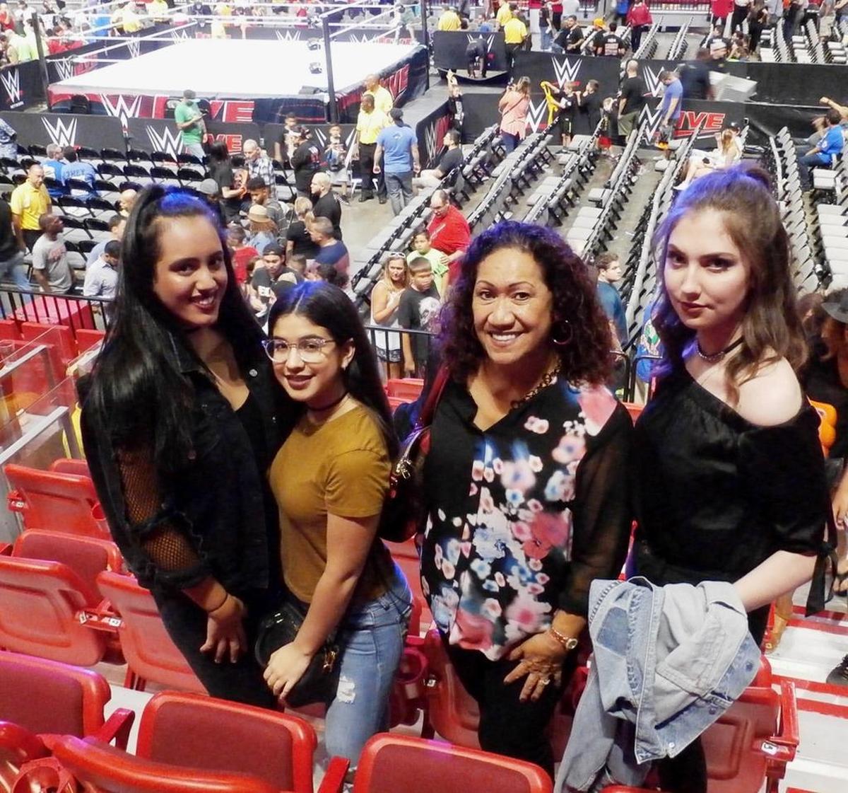 Ata Maivia Johnson with her grand-daughter Simone (left) and her friends during a WWE SmackDown summer show at the AmericanAirlines Arena in Miami.