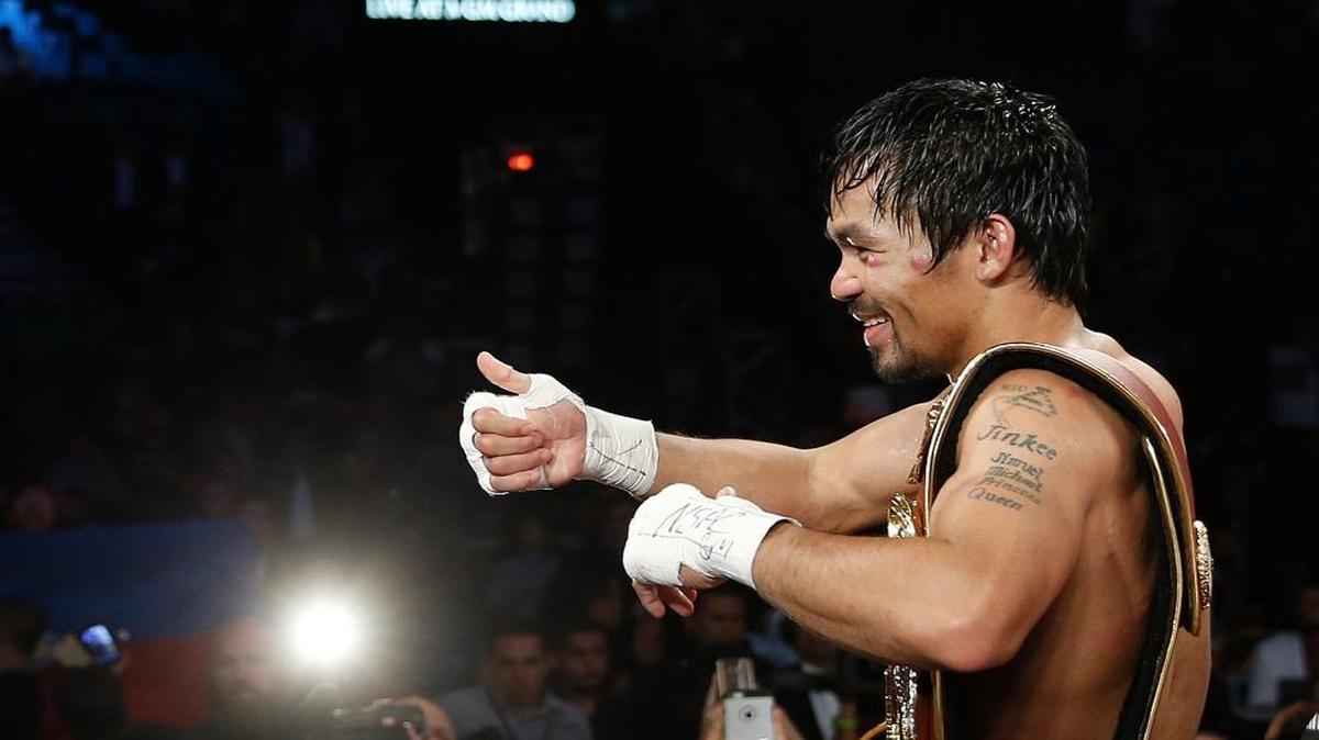 Manny Pacquiao, of the Philippines, celebrates after defeating Timothy Bradley in the WBO welterweight title boxing bout Saturday, April 9, 2016, in Las Vegas.