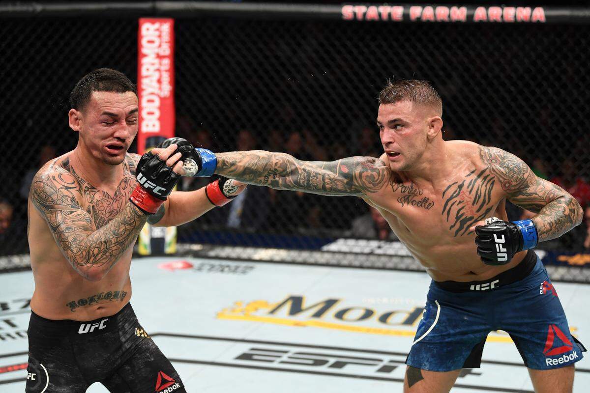 ATLANTA, GA - APRIL 13: (R-L) Dustin Poirier punches Max Holloway in their interim lightweight championship bout during the UFC 236 event at State Farm Arena on April 13, 2019 in Atlanta, Georgia. (Photo by Josh Hedges/Zuffa LLC/Zuffa LLC via Getty Images)