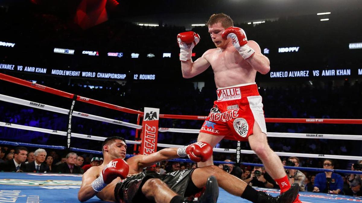 Canelo Alvarez knocked out Amir Khan in the sixth round of their WBC middleweight title fight late Saturday night in Las Vegas.
