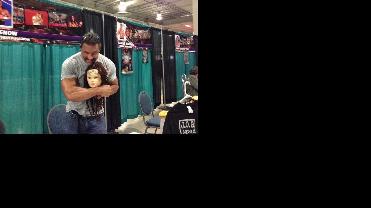 
TNA Impact Wrestling agent Al Snow (with his friend) was one of several pro wrestling stars meeting fans at the Magic City Con Jan. 16-18 at the Miami Airport Convention Center. Snow also wrestled in the Ronin Pro Wrestling show during the three-day event.
