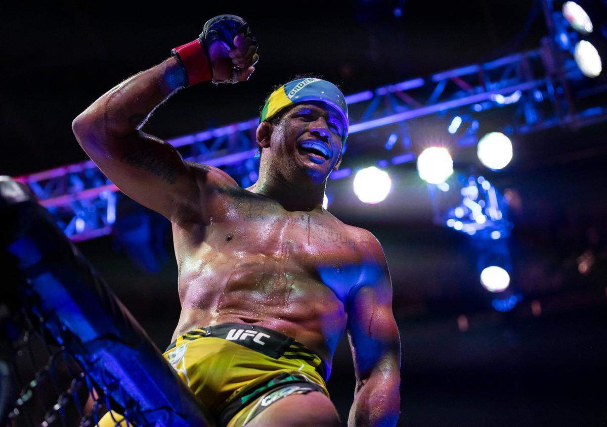 Gilbert Burns celebrates after defeating Jorge Masvidal in their welterweight title match during the UFC 287 event at the Kaseya Center on Saturday, April 8, 2023, in downtown Miami, Fla.