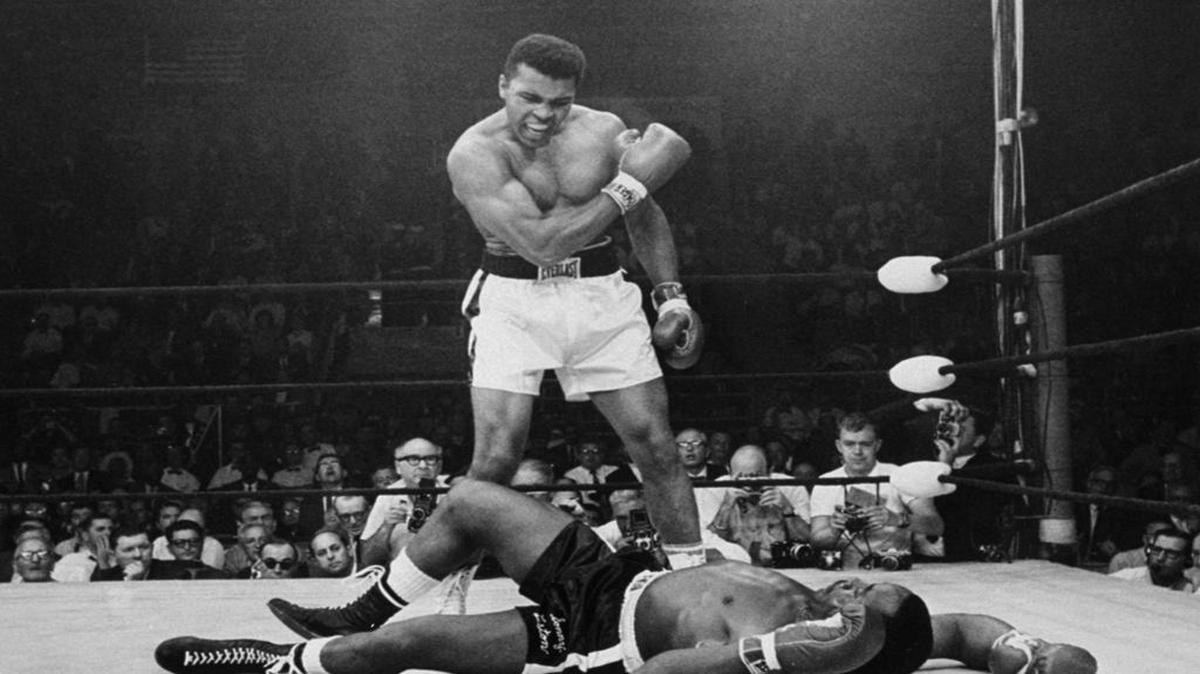 Heavyweight champion Muhammad Ali stands over fallen challenger Sonny Liston, shouting and gesturing shortly after dropping Liston with a short hard right to the jaw on May 25, 1965, in Lewiston, Maine. The bout lasted only one minute into the first round. Ali is the only man ever to win the world heavyweight boxing championship three times. He also won a gold medal in the light-heavyweight division at the 1960 Summer Olympic Games in Rome as a member of the U.S. Olympic boxing team. In 1964 he dropped the name Cassius Clay and adopted the Muslim name Muhammad Ali.