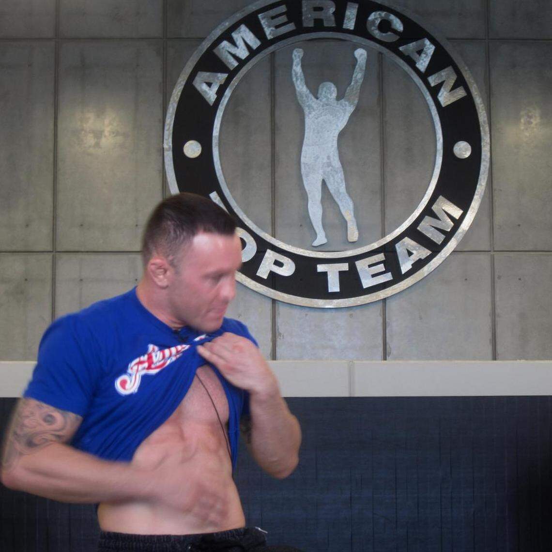 Showing off his abs.