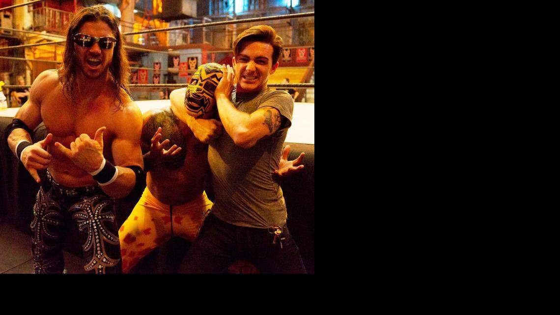 
Johnny Mundo (former WWE superstar John Morrison) cheers actor Drake Bell (right) as he puts Luchadore Prince Puma in a headlock during a break from the tapings of “Lucha Underground” in Boyle Heights, Calif. “Lucha Underground” is 8 p.m. EST Wednesdays on El Rey Network.
