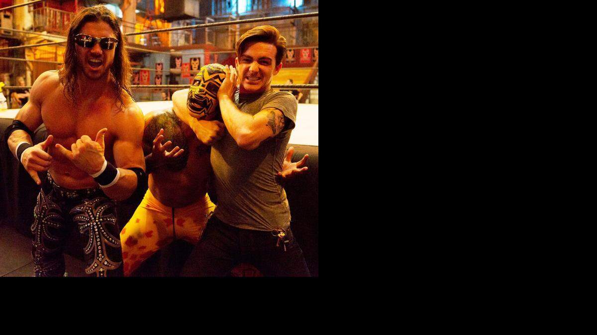 
Johnny Mundo (former WWE superstar John Morrison) cheers actor Drake Bell (right) as he puts Luchadore Prince Puma in a headlock during a break from the tapings of “Lucha Underground” in Boyle Heights, Calif. “Lucha Underground” is 8 p.m. EST Wednesdays on El Rey Network.
