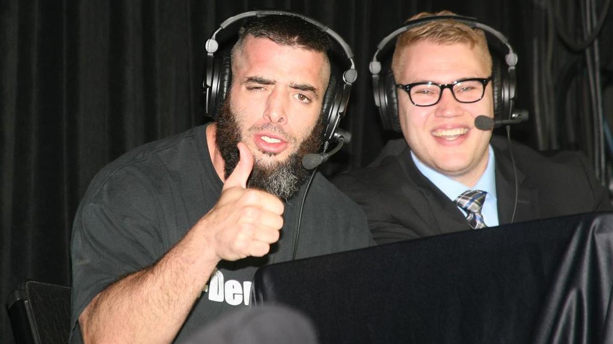 Ring of Honor Death Before Dishonor XV with broadcaster Ian Riccaboni (right) is 9 p.m. ET/ 6 p.m. PT Friday, Sept. 22 from Sam’s Town Live! in Las Vegas and available via pay-per-view and other viewing options. Also pictured is Mark Briscoe, who is competing on the show.