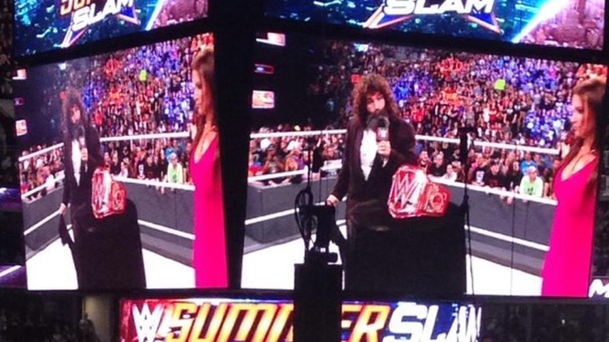 Mick Foley and Stephanie McMahon of Raw with the new red WWE Universal belt during WWE SummerSlam on Sunday, Aug. 21 at Barclays Center in Brooklyn.