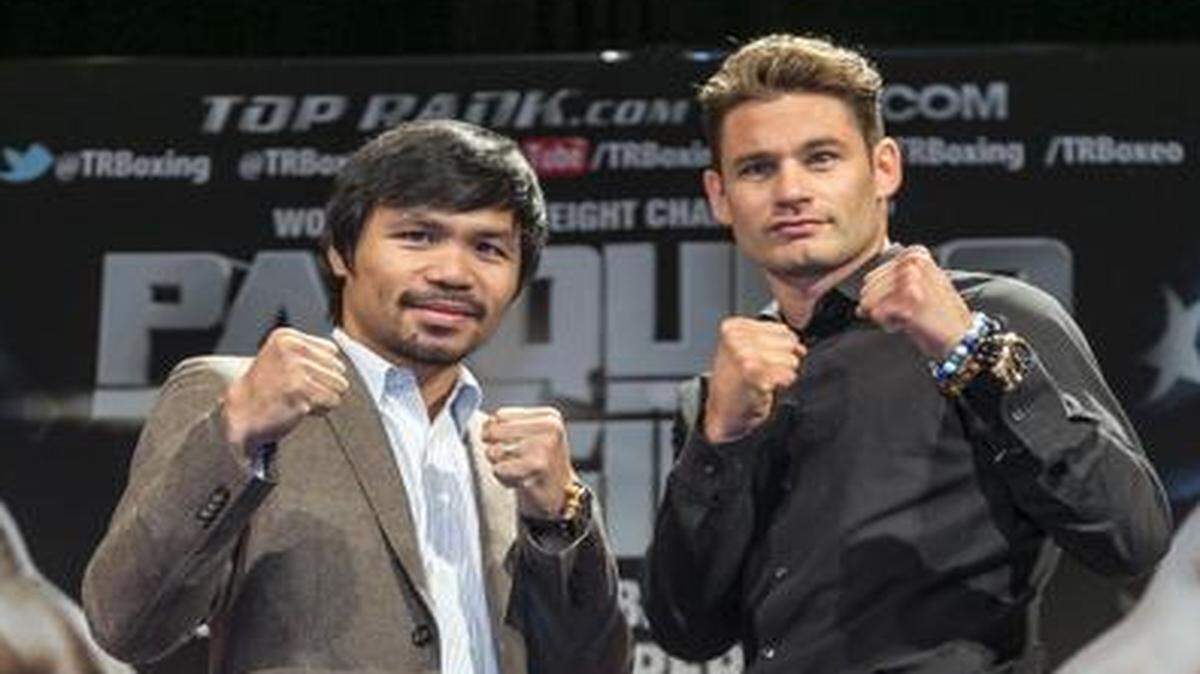 
In this Sept. 3, 2014, file photo, boxers Manny Pacquiao, left, and Chris Algieri pose for a photo in Los Angeles. Algieri still lives at home with his parents, so a trip to China seems like a big deal. It will be even bigger if Algieri capitalizes on his improbable path to fame and beats Pacquiao this month.
