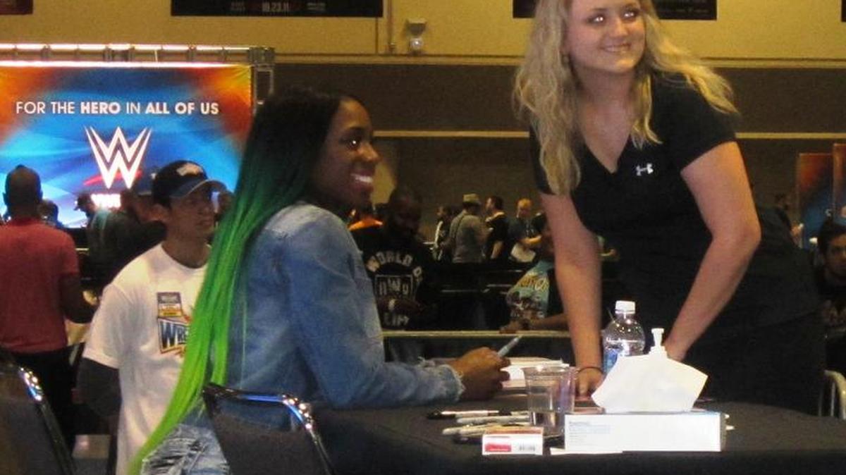 WWE SmackDown women’s champ Naomi signs autographs and poses for photos with fans at WrestleMania Axxess at the Orange County Convention Center in Orlando. Women’s wrestling is at a whole nother level these days.
