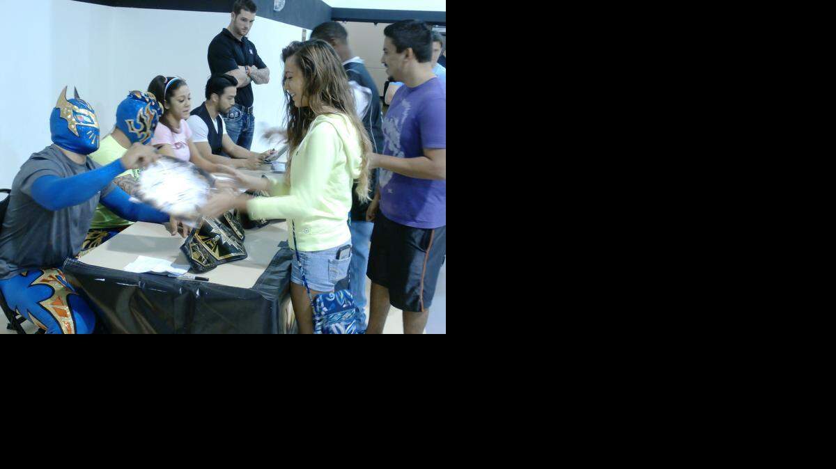
NXT tag team champs The Lucha Dragons (Kalisto and Sin Cara), NXT diva Bayley and NXT superstar Hideo Itami (Kenta) sign autographs and pose for photos with fans during a Meet-n-Greet before a WWE NXT show at the Havert L. Fenn Center in Fort Pierce. NXT returns to the Havert L. Fenn Center on Saturday, Nov. 15 in Fort Pierce.
