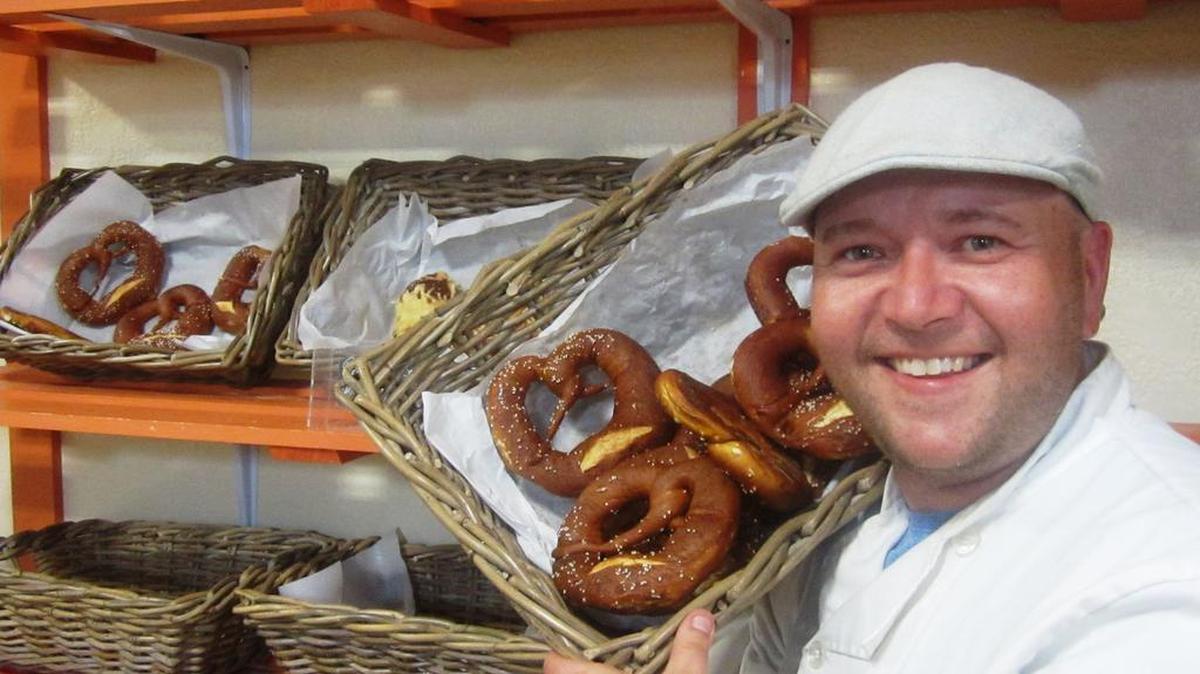 Denny Gruendner, a pro wrestling fan and master baker from Germany, is the owner of Euro Bake World in Winter Gardens, near Orlando. Denny displays some of his pretzels, pastries, breads and rolls. Euro Bake World is part of the fabulous Plant St. Market, which includes the Crooked Can Brewing Company.