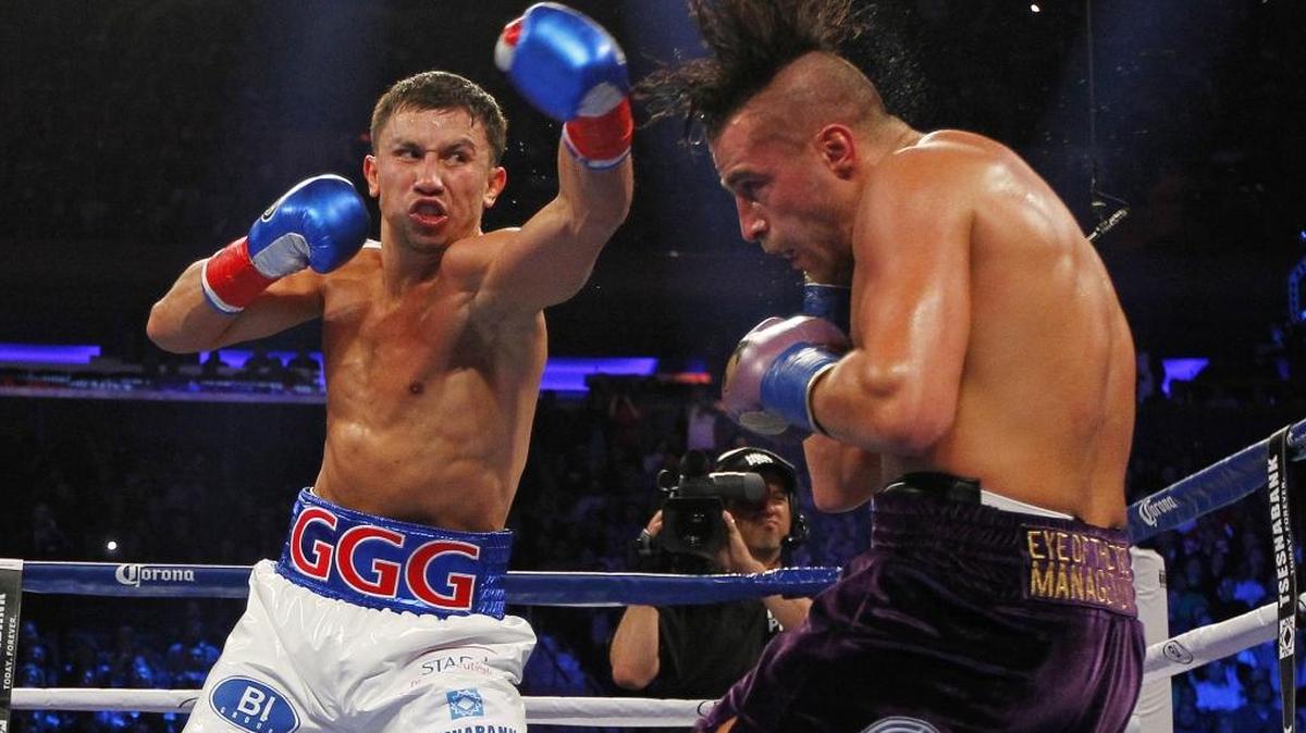 
Gennady Golovkin, left, hits David Lemieux in the second round of a middleweight title fight at Madison Square Garden in New York on Saturday, Oct. 17, 2015. Golovkin won in the eighth round. 
