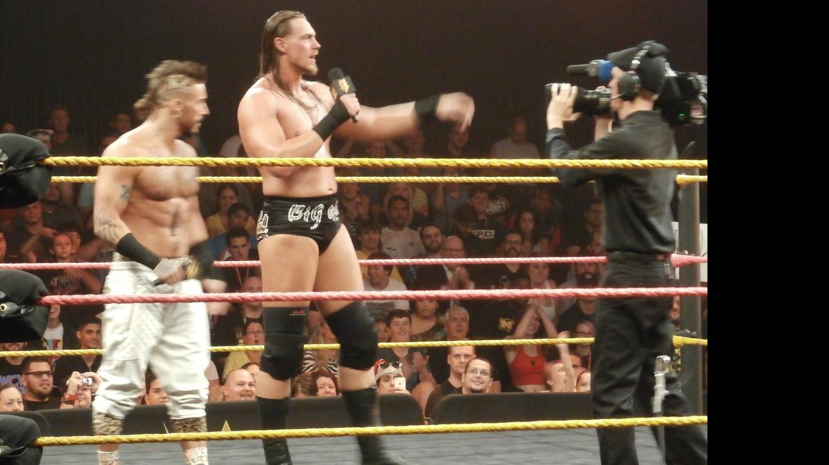 
Big Cass Colin Cassady (center) is big, athletic and can work the mic, complimenting his exceptional trash talking tag team partner, Enzo Amore. They will face NXT tag team champs Blake and Murphy for the titles during the NXT TakeOver: Unstoppable live special on Wednesday, May 20 on WWE Network from Full Sail Live at Full Sail University in Winter Park, near Orlando.
