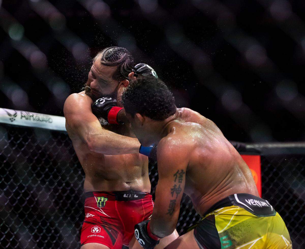 Jorge Masvidal, left, and Gilbert Burns fight in their welterweight title match during the UFC 287 event at the Kaseya Center on Saturday, April 8, 2023, in downtown Miami, Fla.
