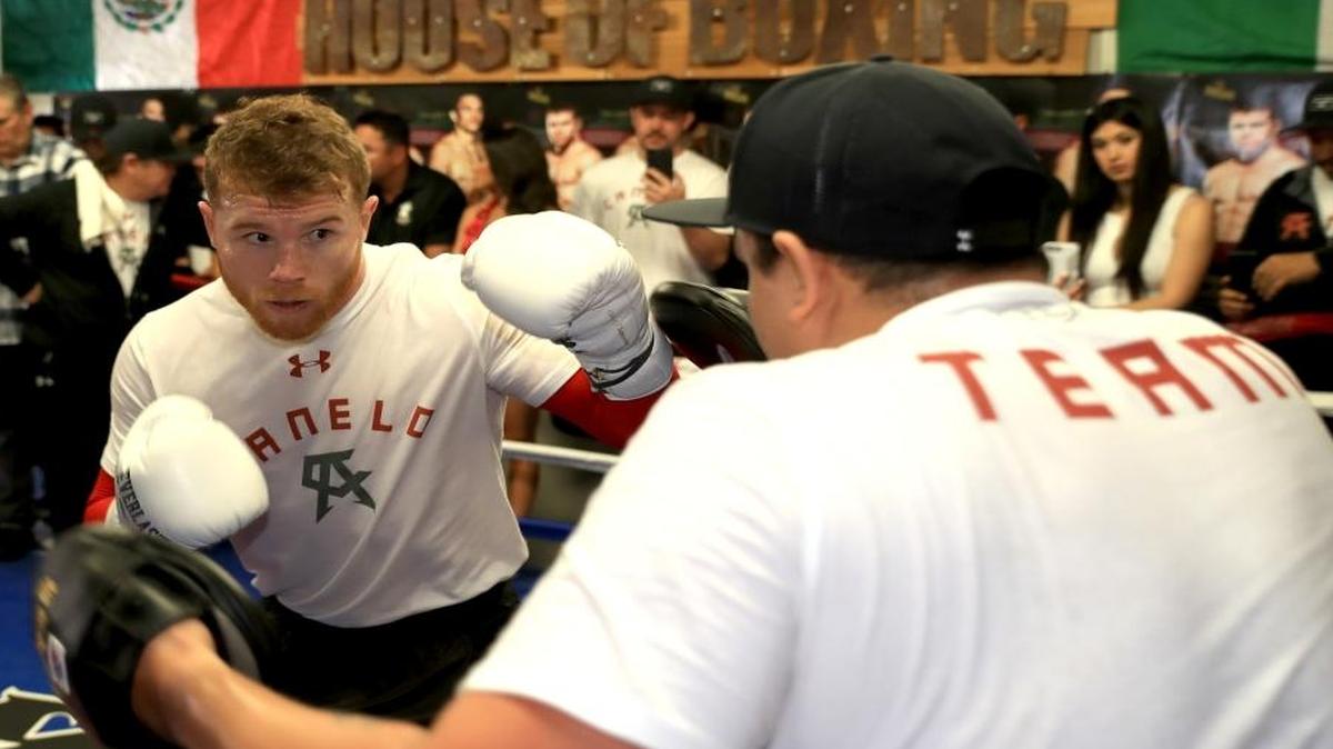 Boxer Canelo Alvarez of Mexico hits focus pads with a trainer in the ring during his Open Workout at the House of Boxing on April 19, 2017 in National City, California. Canelo Alvarez fights Julio Cesar Chavez Jr. on May 6, 2017 in Las Vegas, Nevada.