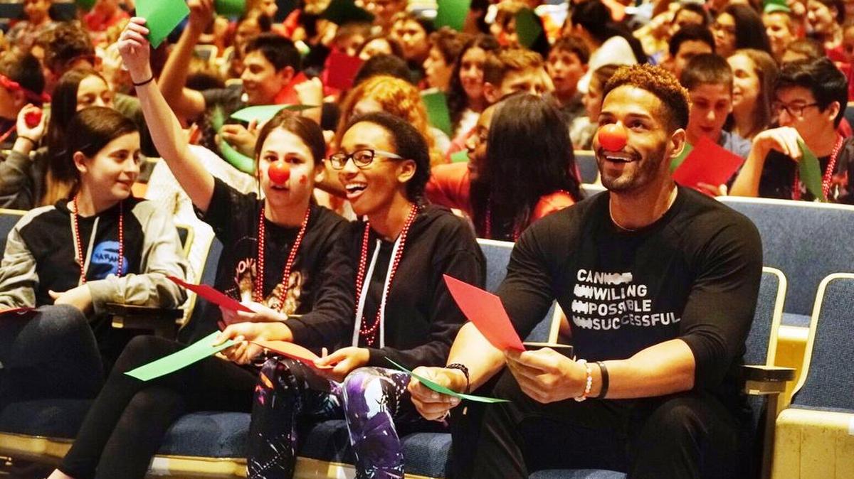 Comic Relief, the non-profit behind Red Nose Day, brought WWE Superstar Darren Young (right) and WWE Ambassador Dana Warrior to Elm Place Middle School in Highland Park, Ill. as part of an event to inspire the students to join the national fundraising campaign.
