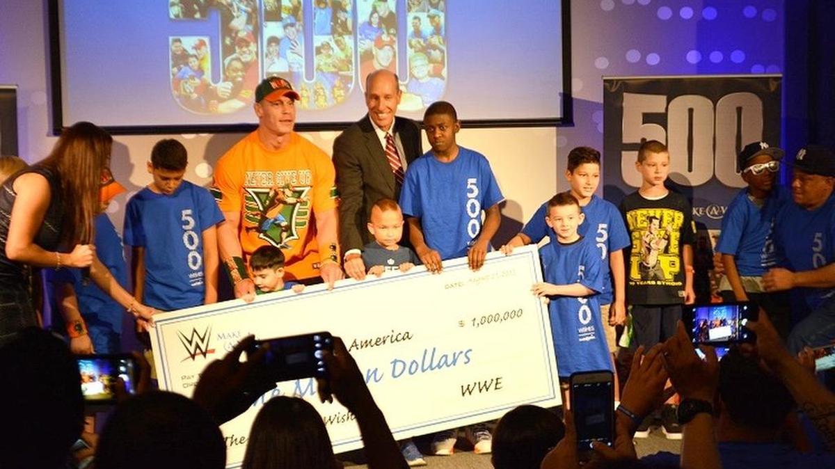 
WWE’s John Cena welcomes the Wish kids on stage to help accept the $1 million check WWE donated to Make-A-Wish during a special event on Friday, Aug. 21 at Dave & Buster’s in Times Square as part of WWE SummerSlam Weekend in New York City.
