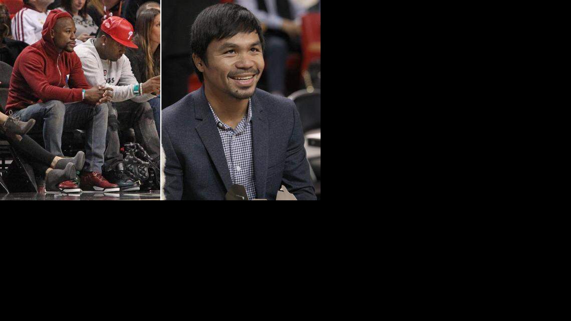 Floyd Mayweather, left, and Manny Pacquiao, right, attended the Miami Heat's game against the Milwaukee Bucks on Jan. 27, 2015.