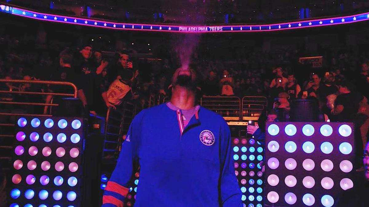 Philadelphia 76ers center Joel Embiid does his best Triple H impersonation during the introductions of the starting line-ups as the 76ers played the Charlotte Hornets at the Wells Fargo Center, which has housed WWE events in Philadelphia.