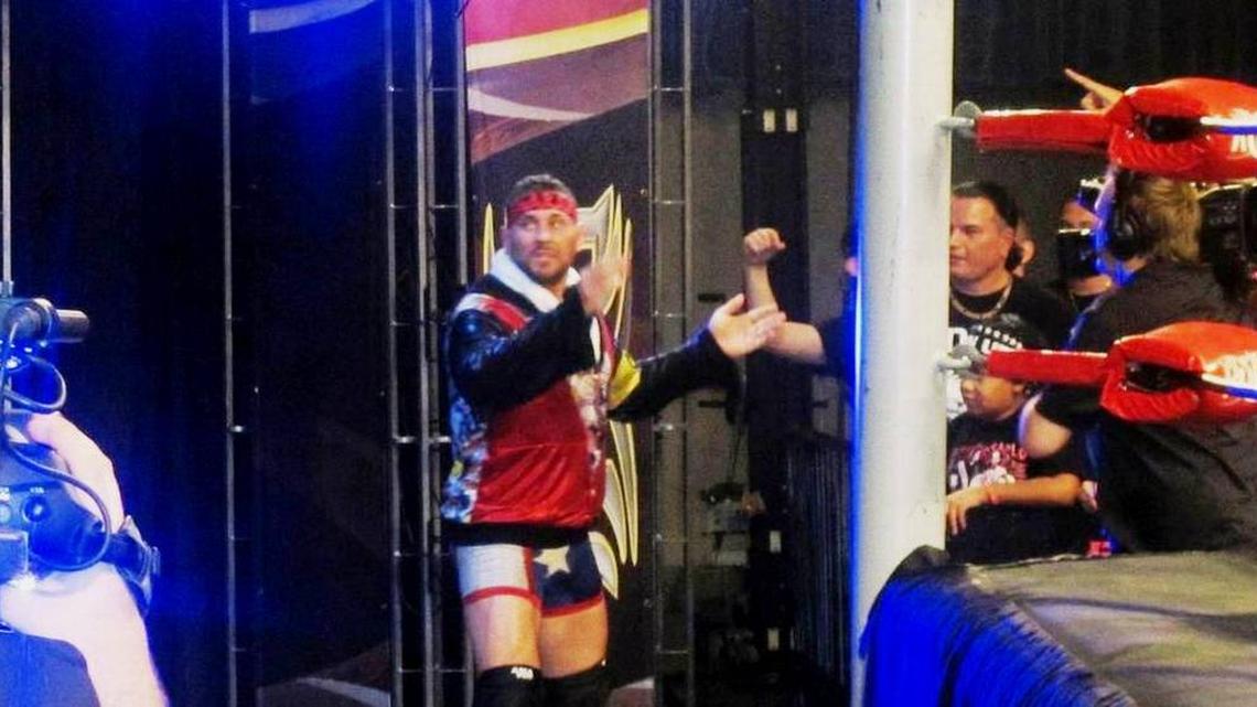 Ring of Honor broadcasters Colt Cabana (pictured) and Ian Riccaboni will be raising money for relief efforts in Puerto Rico before ROH shows on Saturday, Nov. 11 in Fort Lauderdale and Sunday, Nov. 12 in Lakeland. Also pictured is ROH fan Gonzo Arbulu from last year’s ROH show in Fort Lauderdale.